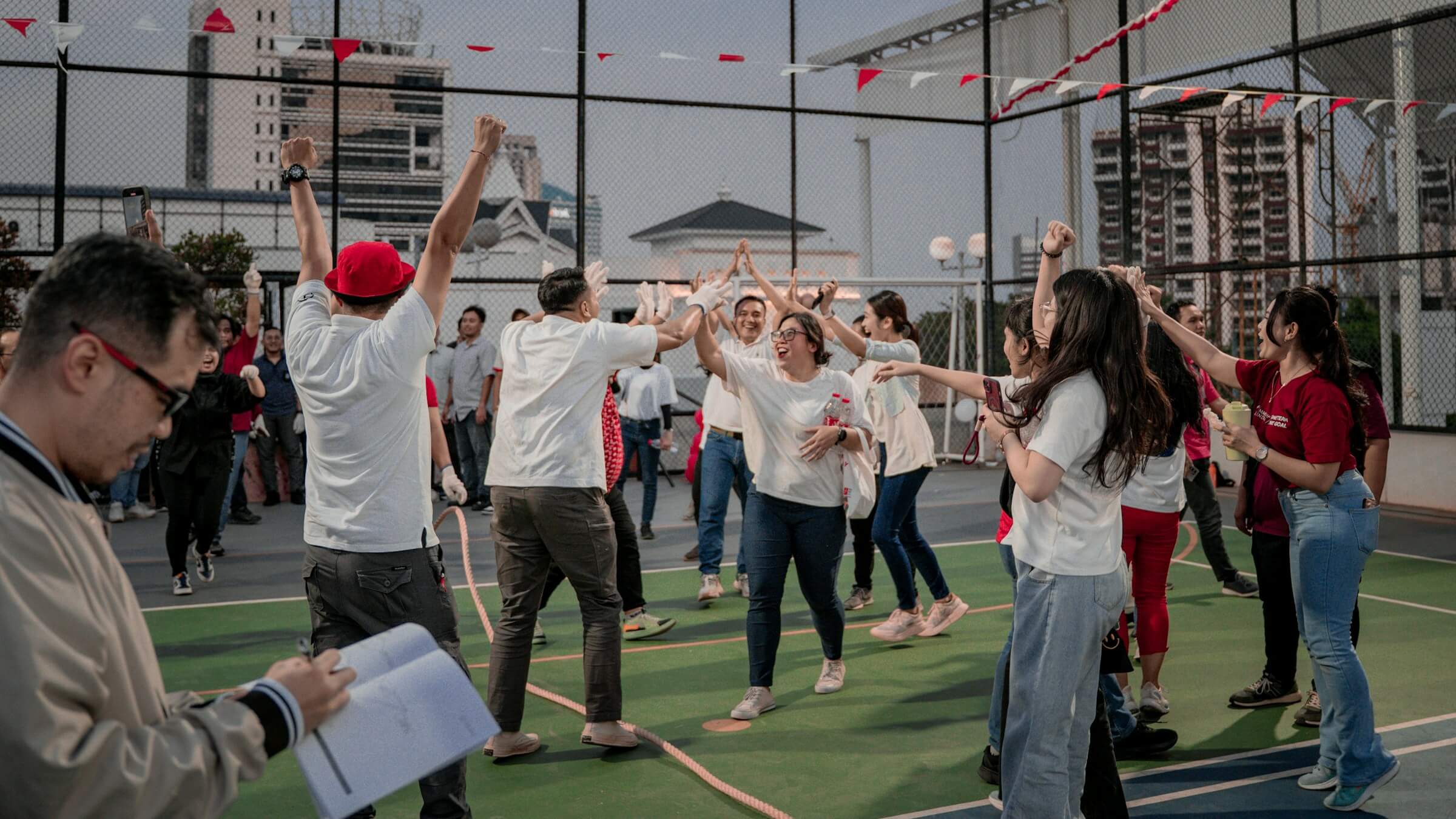 Employees participating in a team building activity to improve employee engagement and strengthen workplace relationships.